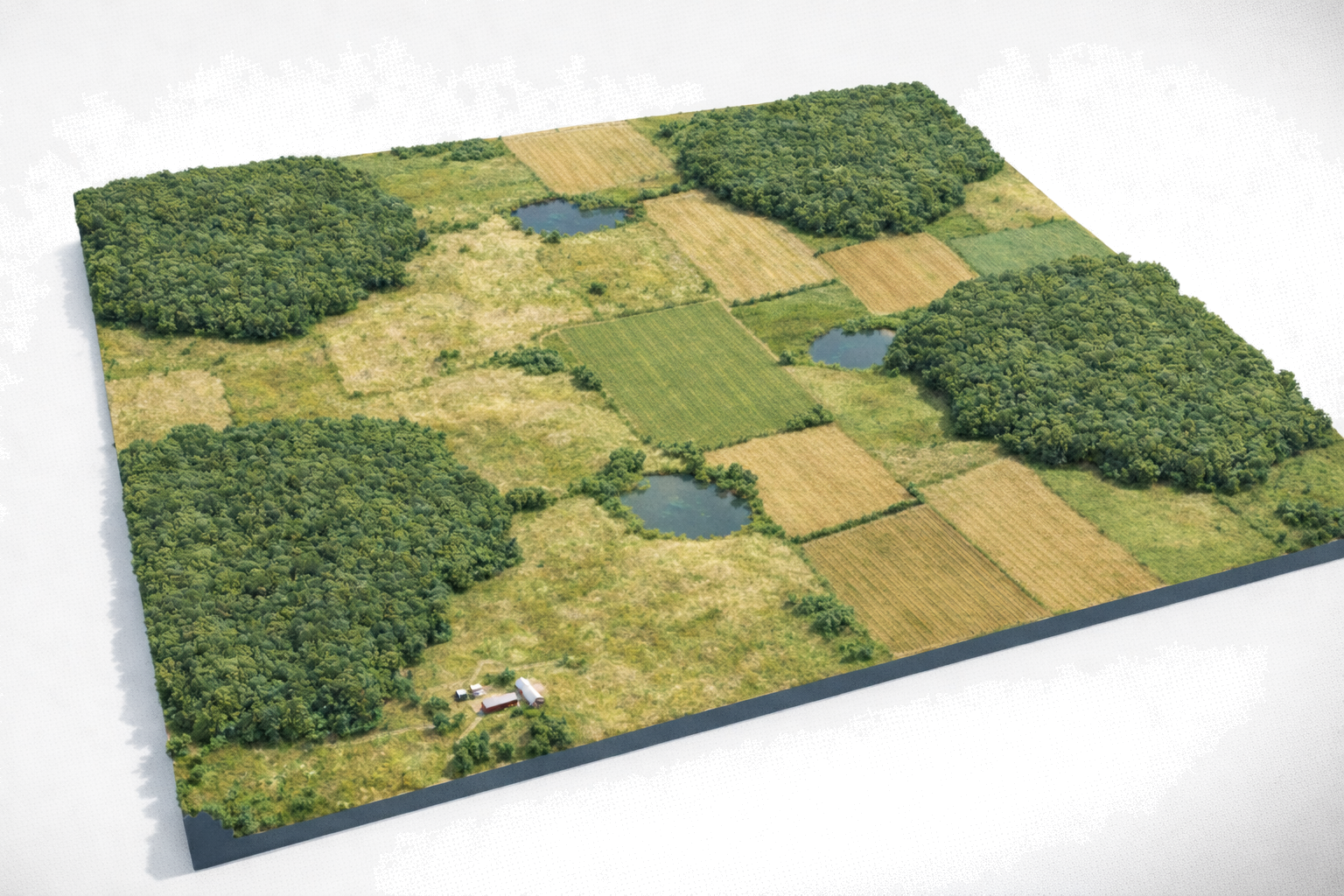 Aerial landscape mosaic with forests, fields, and water bodies.